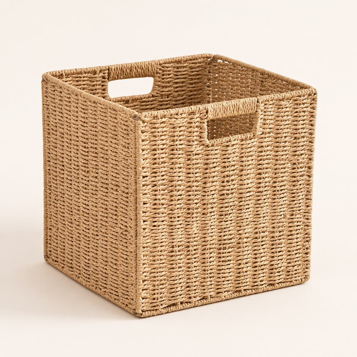 Handwoven foldable storage bin in natural woven grass fiber