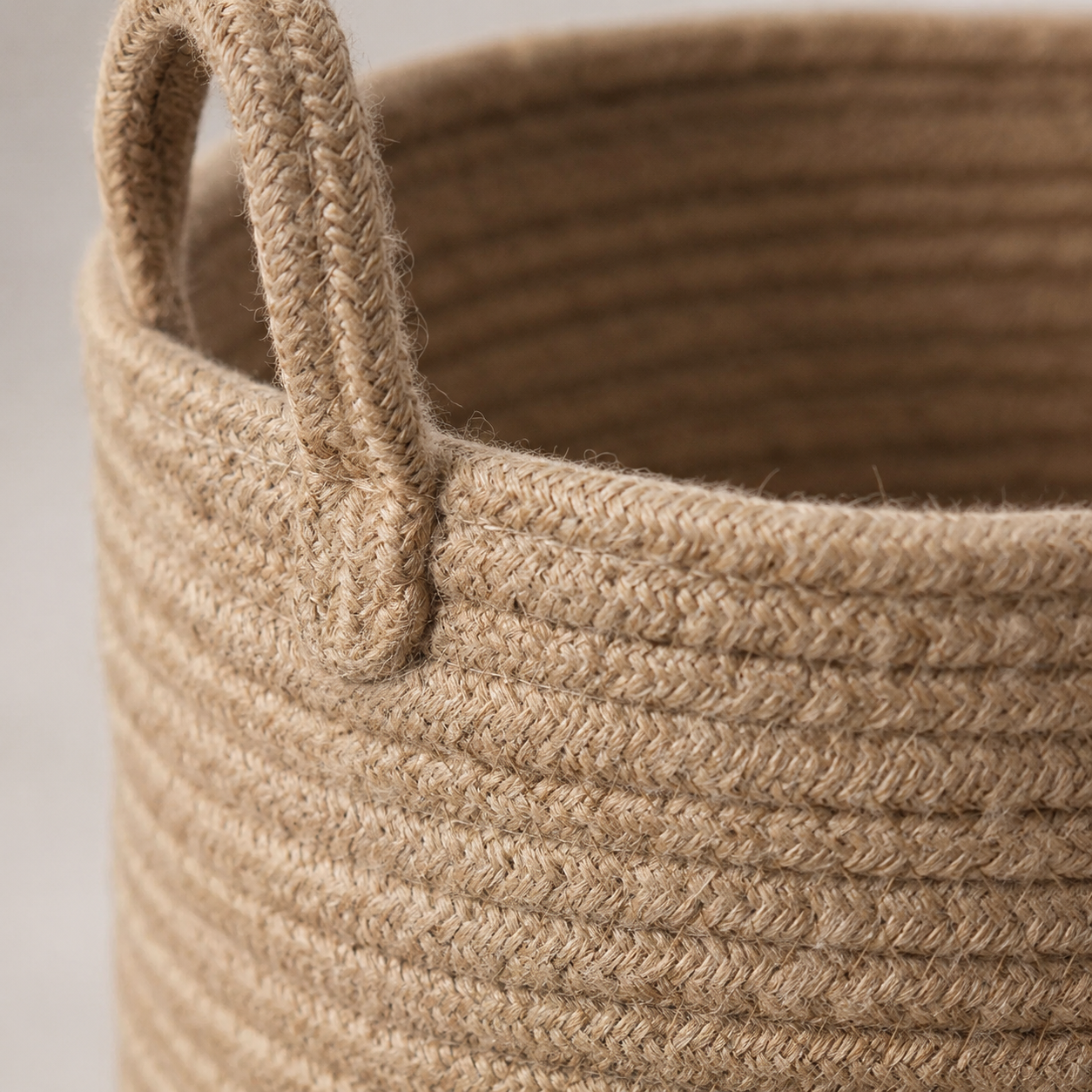 Close-up of handwoven jute rope texture on storage basket