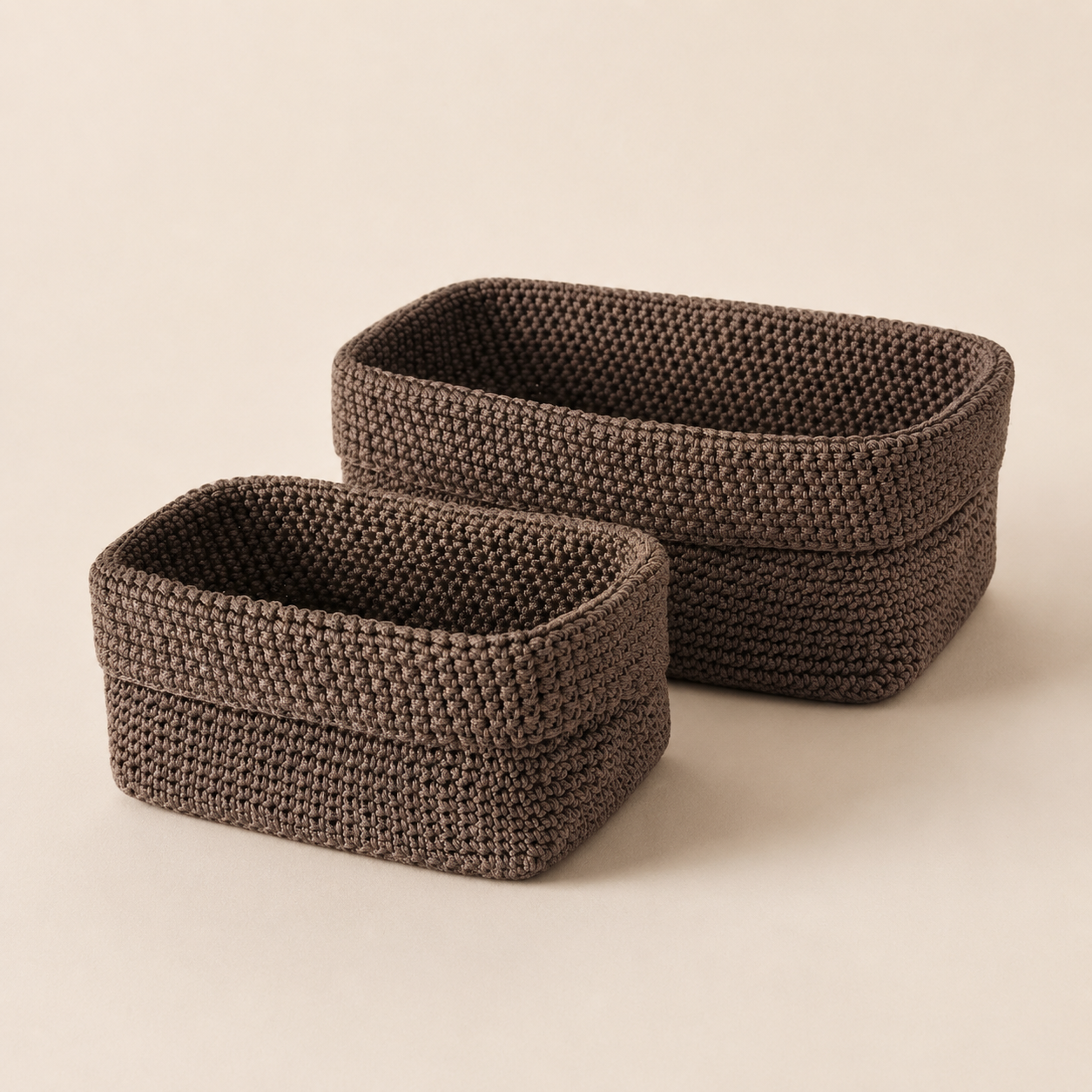 Brown handwoven textured storage basket set in small and large sizes